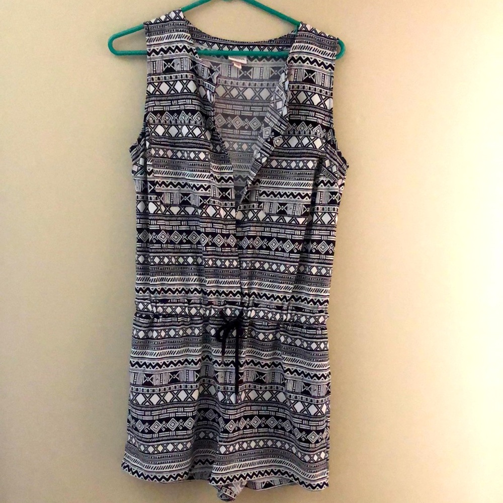 Romper with black and white print. Size medium.